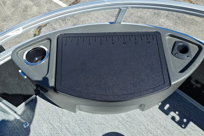 Slide: The Image of 2027 Sun Tracker Bass Buggy 18 DLX fishing station with measuring board and cup holders. - 37