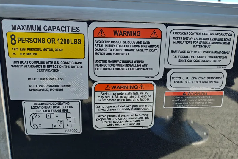 Slide: The Image of Sun Tracker Bass Buggy 18 DLX 2027 capacity and safety warnings label. - 22