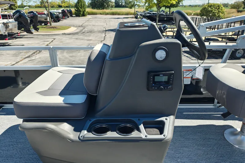 Slide: The Image of 2027 Sun Tracker Bass Buggy 18 DLX boat interior with steering console and seating. - 14
