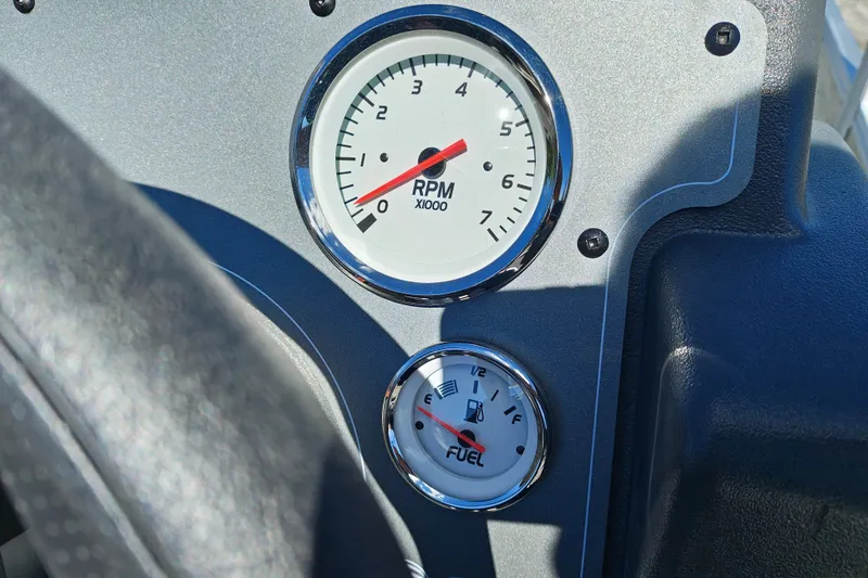 Slide: The Image of Dashboard of 2027 Sun Tracker Bass Buggy 18 DLX with RPM and fuel gauges. - 20