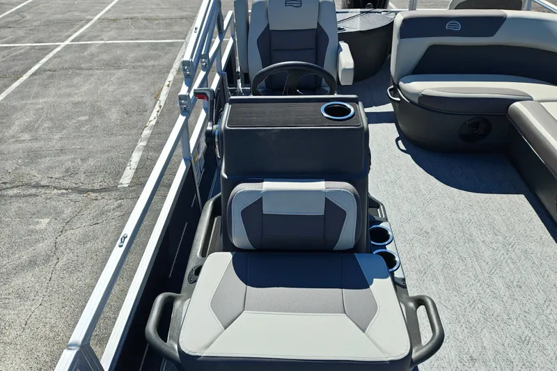 Slide: The Image of 2027 Sun Tracker Bass Buggy 18 DLX interior with seating and steering console. - 16