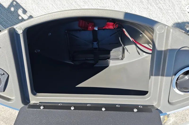 Slide: The Image of Storage compartment of 2027 Sun Tracker Bass Buggy 18 DLX boat with wiring visible. - 38