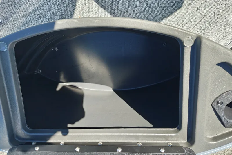 Slide: The Image of Storage compartment of 2027 Sun Tracker Bass Buggy 18 DLX boat, open and empty. - 40