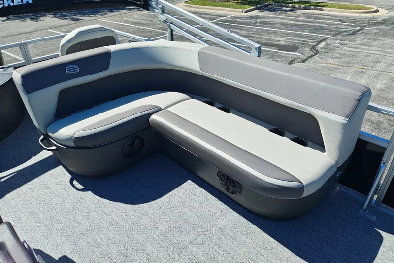 Slide: The Image of 2027 Sun Tracker Bass Buggy 18 DLX pontoon boat seating area with cup holders. - 23