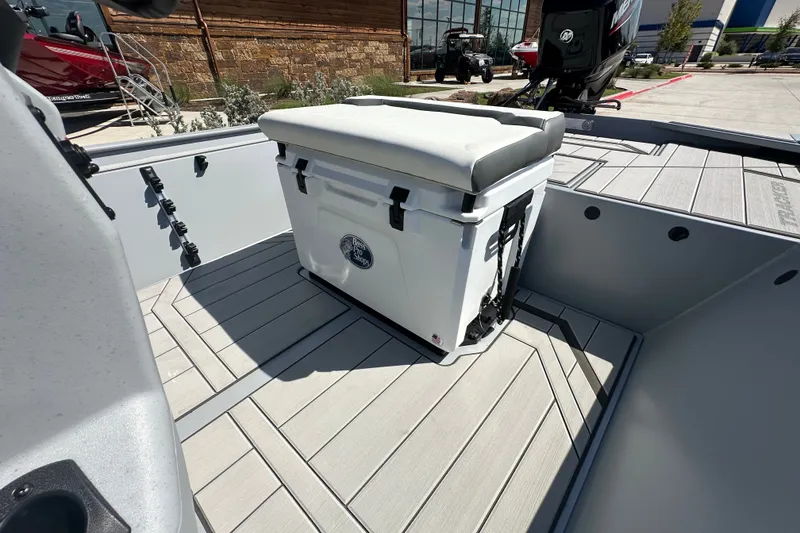Slide: The Image of 2027 Tracker Bass Tracker Classic CC boat interior with cushioned cooler seat. - 15