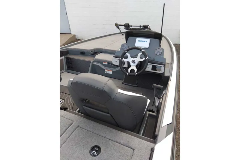 Slide: The Image of 2027 Nitro Z20 XL boat cockpit with steering wheel and Lowrance display. - 4