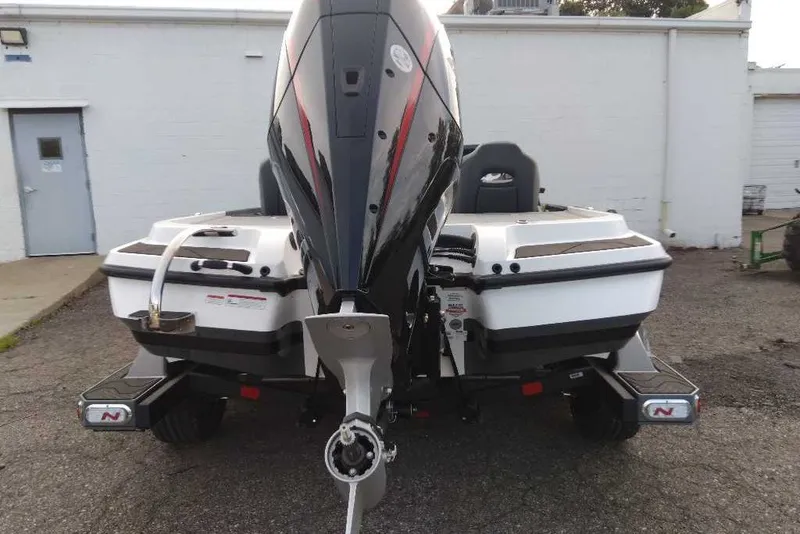 Slide: The Image of Rear view of a 2027 Nitro Z20 XL boat with powerful outboard motor. - 41