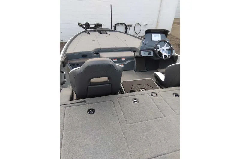 Slide: The Image of 2027 Nitro Z20 XL boat interior with steering wheel and seating. - 3