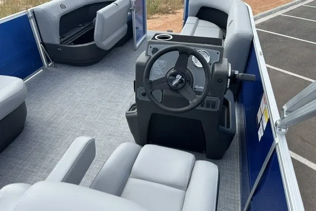 Slide: The Image of Interior of a 2027 Sun Tracker Party Barge 16 DLX pontoon boat with gray seating. - 14
