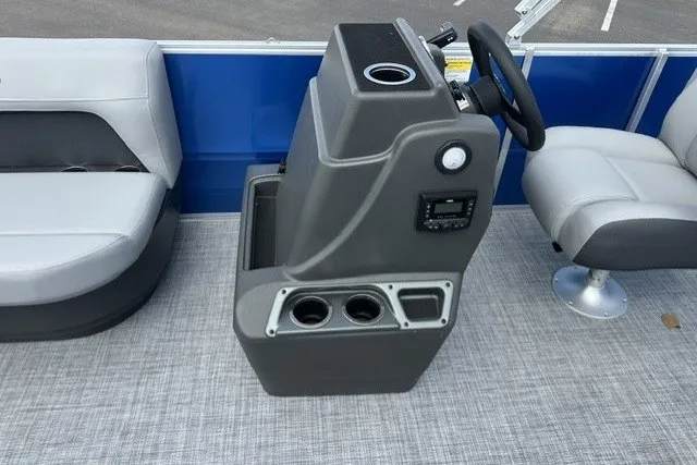 Slide: The Image of 2027 Sun Tracker Party Barge 16 DLX interior with steering console and seating. - 15
