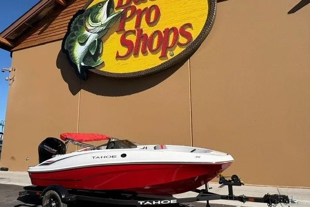 Slide: The Image of 2027 Tahoe T16 boat displayed outside Bass Pro Shops store. - 1