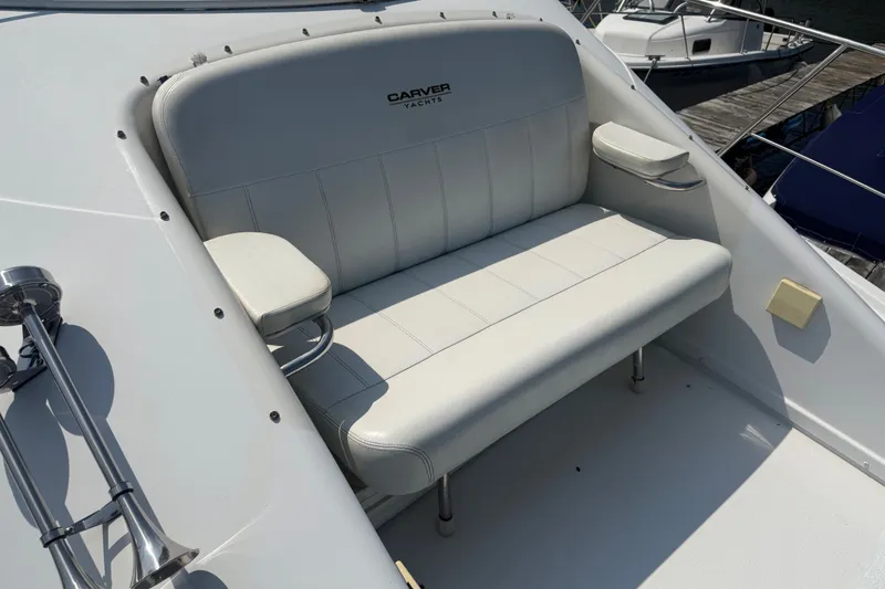 Slide: The Image of White seating area on a 1998 Carver 350 Mariner yacht deck. - 8