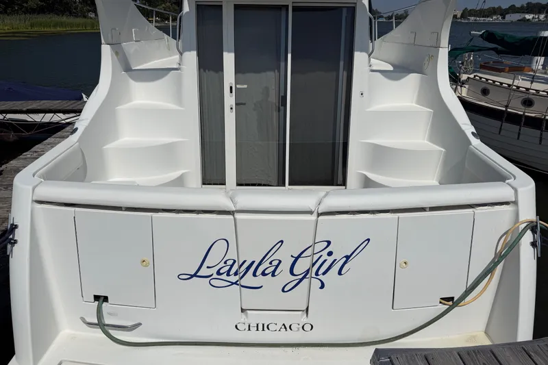 Slide: The Image of 1998 Carver 350 Mariner yacht named "Layla Girl" docked in Chicago marina. - 5