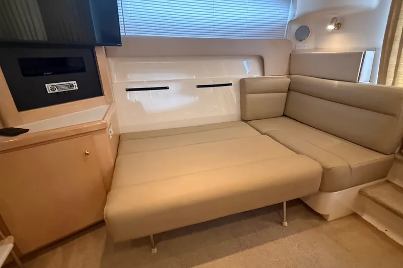 Slide: The Image of 1998 Carver 350 Mariner interior with beige seating and entertainment area. - 19