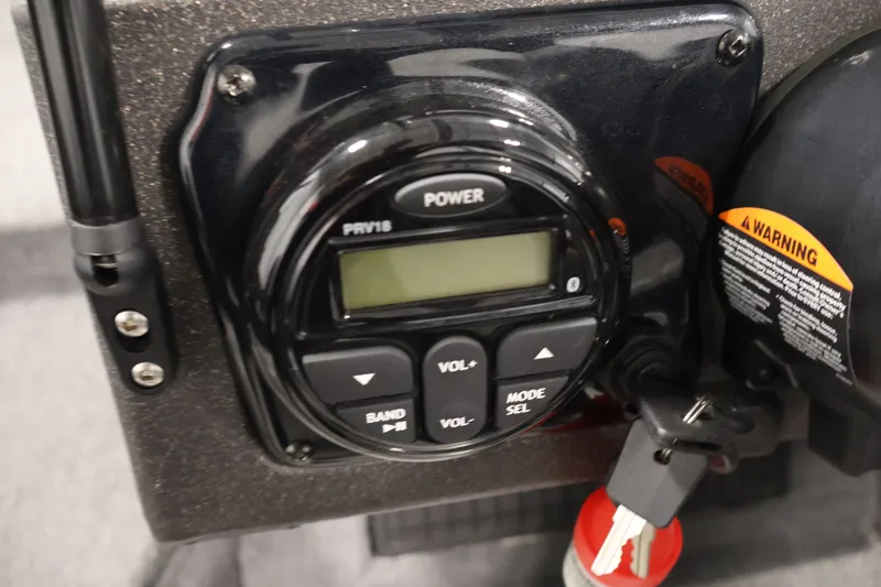 Slide: The Image of Control panel of 2022 Tracker Targa V-19 WT boat with power and volume buttons. - 33