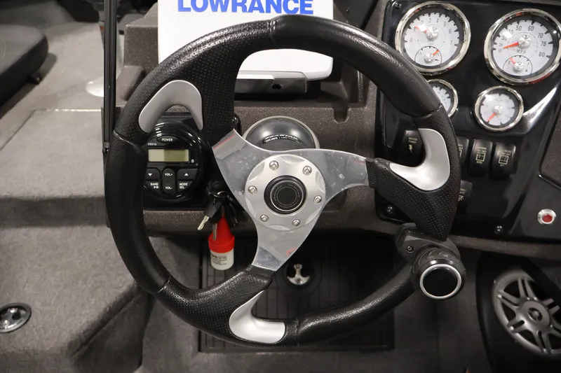 Slide: The Image of Steering wheel of 2022 Tracker Targa V-19 WT boat with gauges and controls. - 27