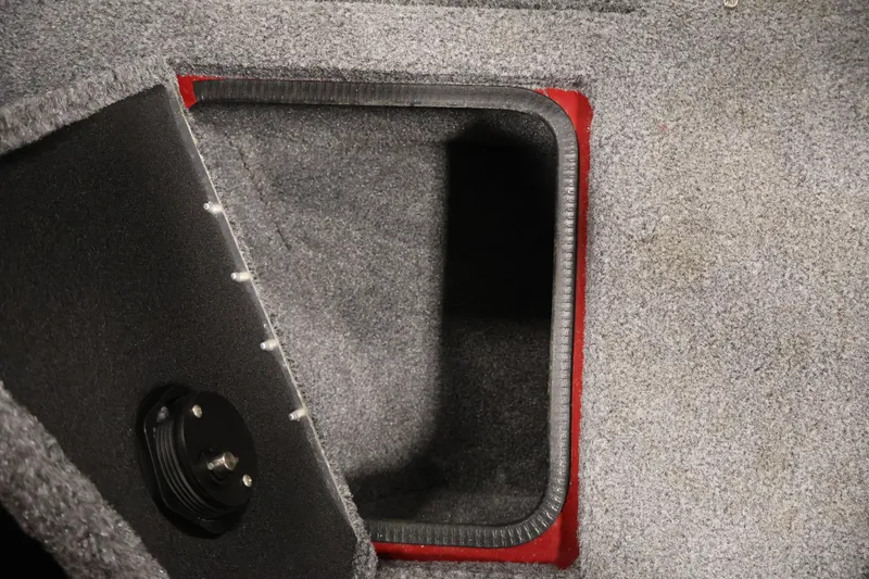 Slide: The Image of 2022 Tracker Targa V-19 WT boat storage compartment with carpeted interior. - 22