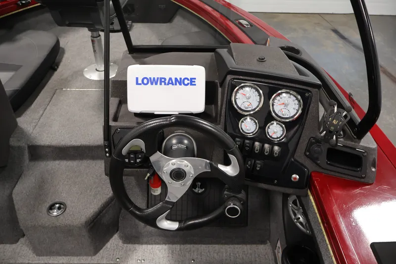Slide: The Image of 2022 Tracker Targa V-19 WT boat dashboard with Lowrance display and gauges. - 26