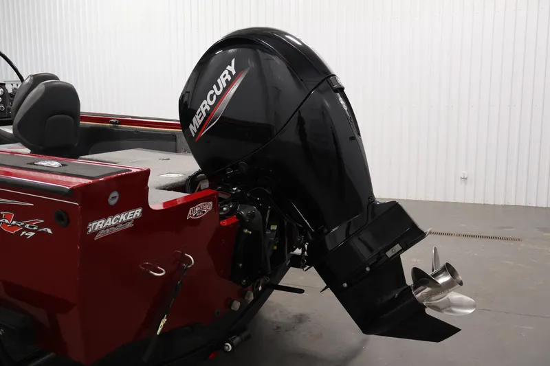 Slide: The Image of 2022 Tracker Targa V-19 WT boat with Mercury outboard motor in a garage. - 51