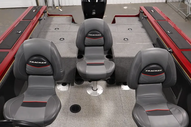 Slide: The Image of 2022 Tracker Targa V-19 WT boat interior with three gray seats and red accents. - 39