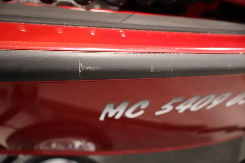 Slide: The Image of 2022 Tracker Targa V-19 WT boat with visible registration number and minor scratches. - 63