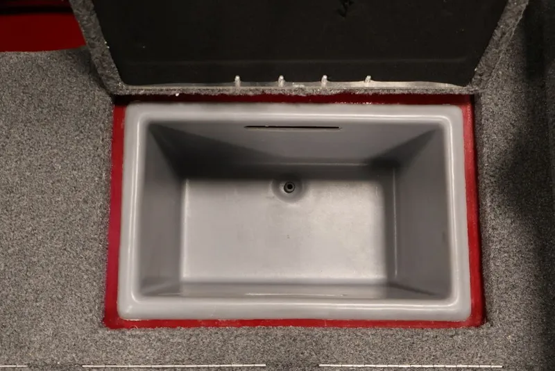 Slide: The Image of Open storage compartment in 2022 Tracker Targa V-19 WT boat, featuring gray interior. - 41