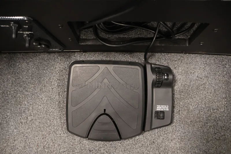 Slide: The Image of Foot pedal control on 2022 Tracker Targa V-19 WT boat, featuring Minn Kota branding. - 14