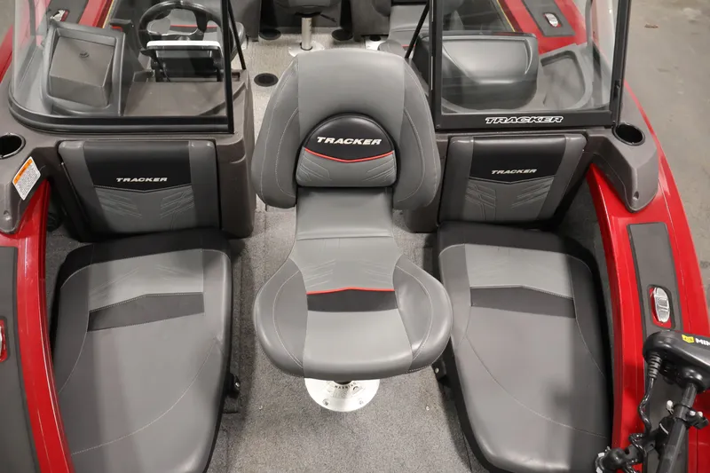 Slide: The Image of 2022 Tracker Targa V-19 WT boat interior with gray and red seating. - 16