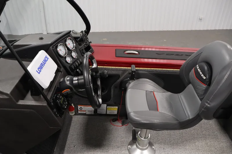 Slide: The Image of 2022 Tracker Targa V-19 WT boat interior with steering wheel and seat. - 25