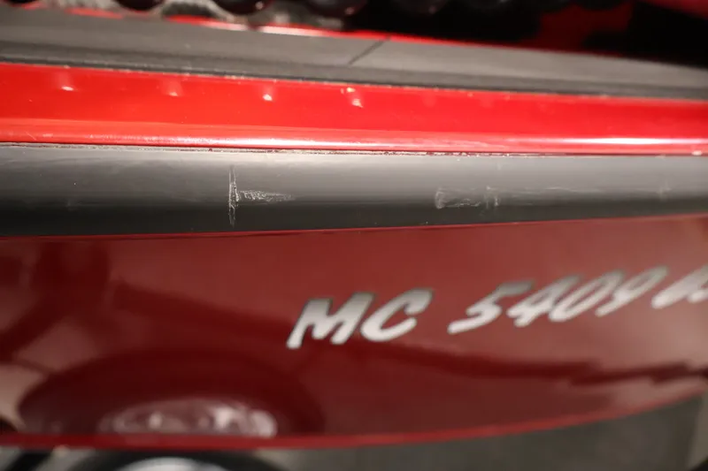 Slide: The Image of Red Tracker Targa V-19 WT boat with visible scratches, partial registration number. - 60