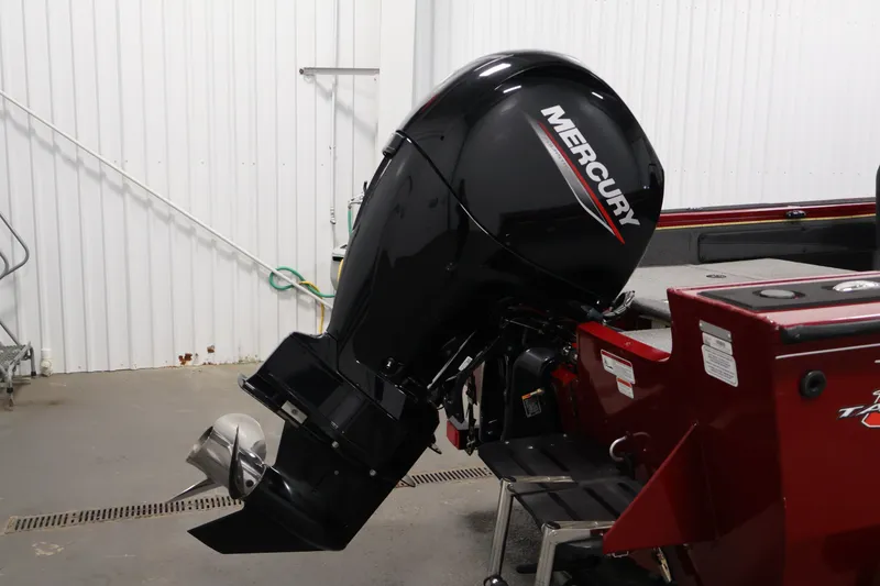 Slide: The Image of 2022 Tracker Targa V-19 WT with Mercury outboard motor in a garage setting. - 50