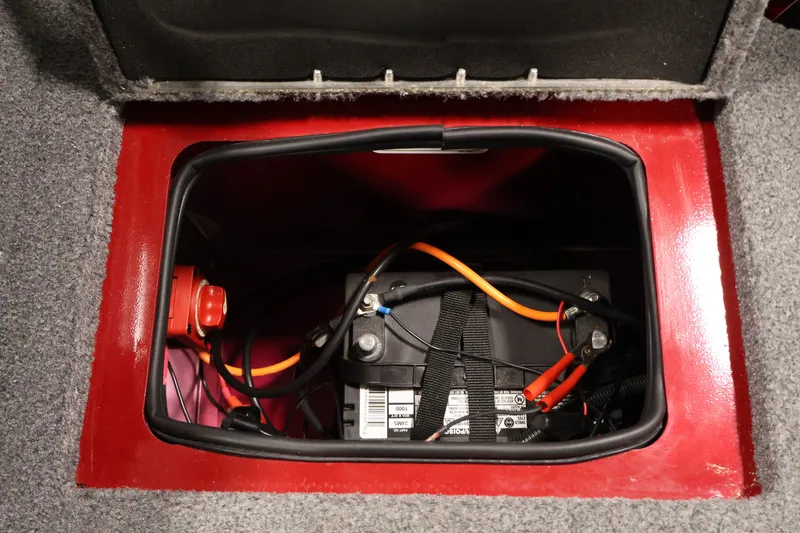 Slide: The Image of Battery compartment of 2022 Tracker Targa V-19 WT boat, featuring wiring and secure straps. - 44