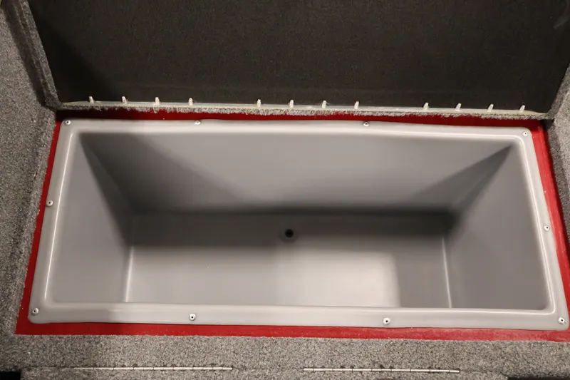 Slide: The Image of Open storage compartment in 2022 Tracker Targa V-19 WT boat, featuring gray interior. - 43