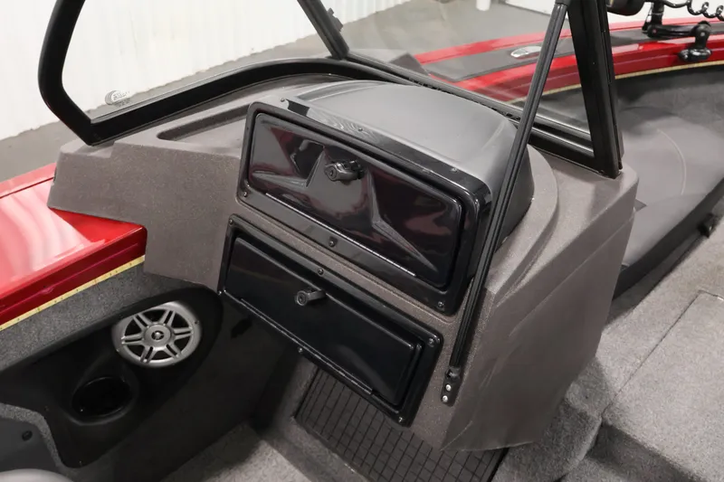 Slide: The Image of 2022 Tracker Targa V-19 WT boat interior with storage compartments and speaker. - 36