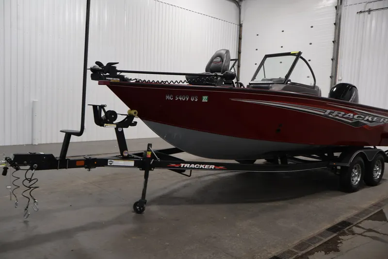 Slide: The Image of 2022 Tracker Targa V-19 WT boat on trailer in indoor setting. - 57