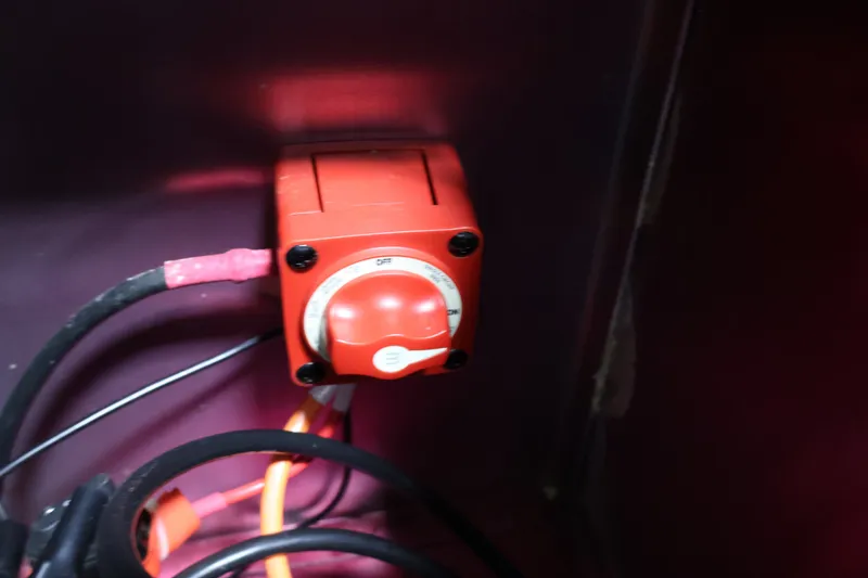 Slide: The Image of Red battery switch in a 2022 Tracker Targa V-19 WT boat. - 45