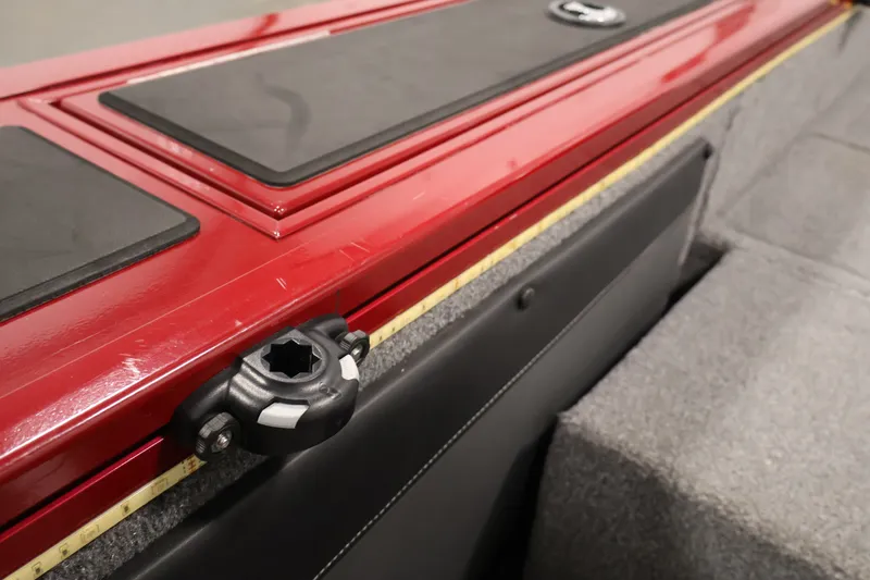 Slide: The Image of 2022 Tracker Targa V-19 WT boat interior with red trim and black seating. - 47