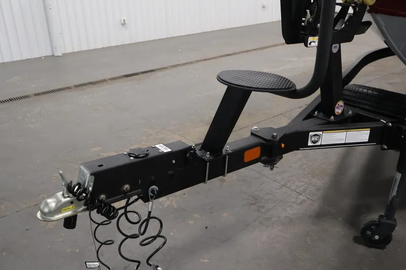 Slide: The Image of Trailer hitch of 2022 Tracker Targa V-19 WT boat in a garage setting. - 54