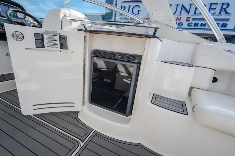 Slide: The Image of 2006 Sea Ray 270 SLX boat interior with open storage compartment and seating area. - 17