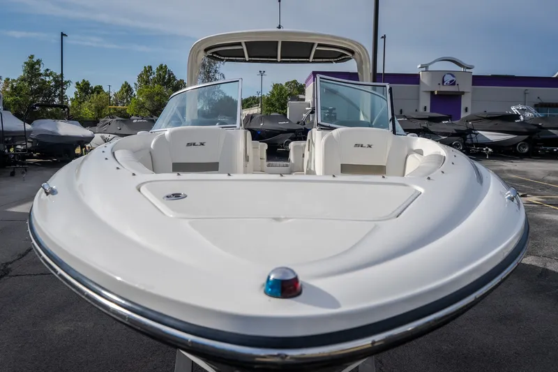 Slide: The Image of 2006 Sea Ray 270 SLX boat displayed outdoors, showcasing sleek design and spacious seating. - 6