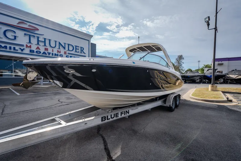 Slide: The Image of 2006 Sea Ray 270 SLX boat on trailer at Big Thunder Marine dealership. - 1