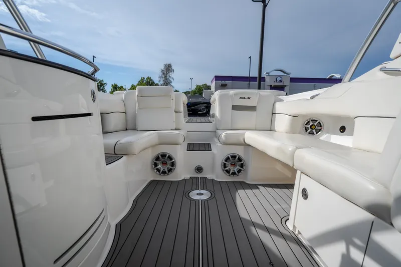 Slide: The Image of Interior view of a 2006 Sea Ray 270 SLX boat with white seating and speakers. - 37