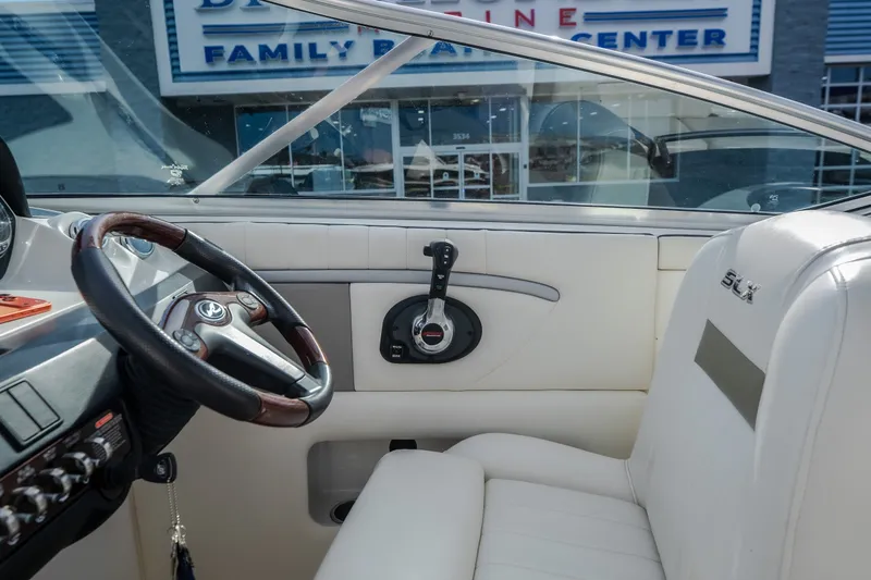 Slide: The Image of Interior of a 2006 Sea Ray 270 SLX boat with steering wheel and controls. - 39