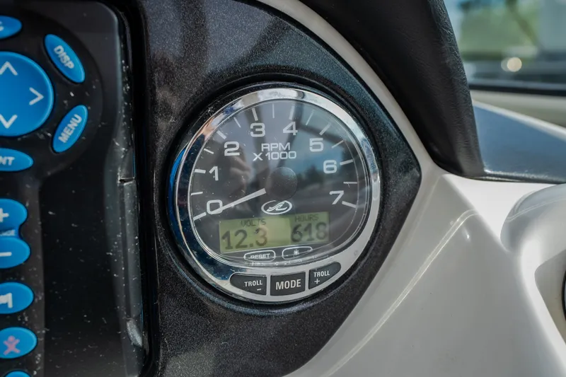 Slide: The Image of Close-up of 2006 Sea Ray 270 SLX tachometer displaying RPM and engine hours. - 47