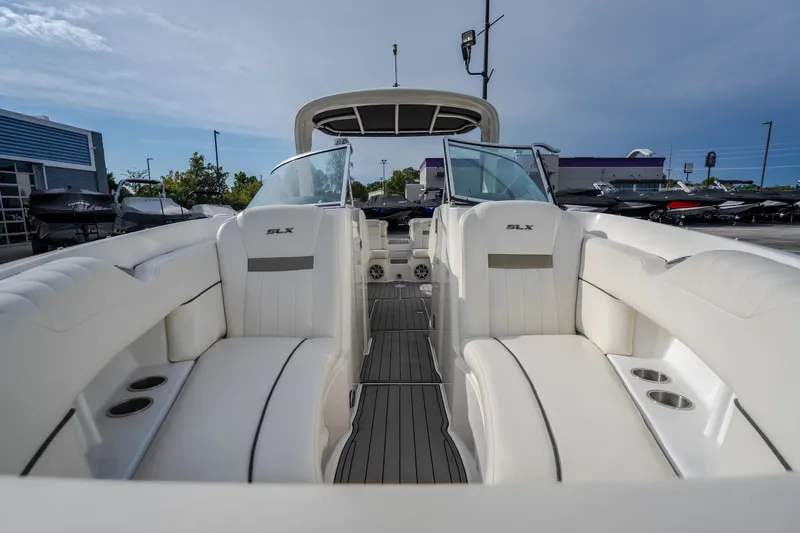 Slide: The Image of 2006 Sea Ray 270 SLX boat interior with white seating and open deck view. - 33