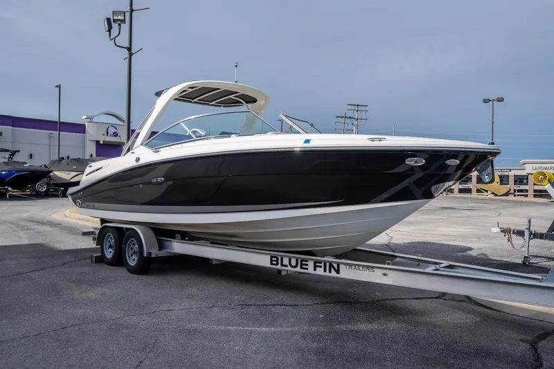 Slide: The Image of 2006 Sea Ray 270 SLX boat on Blue Fin trailer in parking lot. - 4