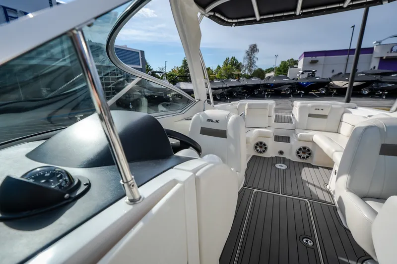 Slide: The Image of Interior view of 2006 Sea Ray 270 SLX boat with white seating and sleek design. - 35