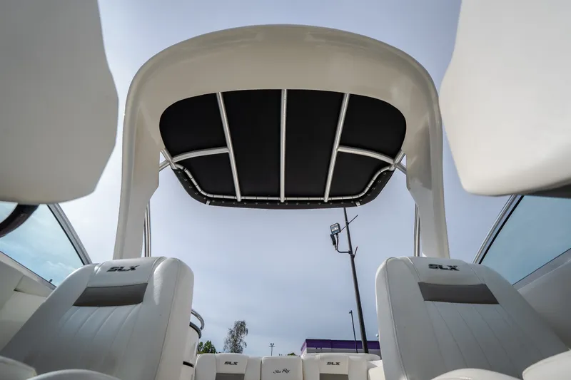 Slide: The Image of 2006 Sea Ray 270 SLX boat interior with canopy and SLX-branded seats. - 36