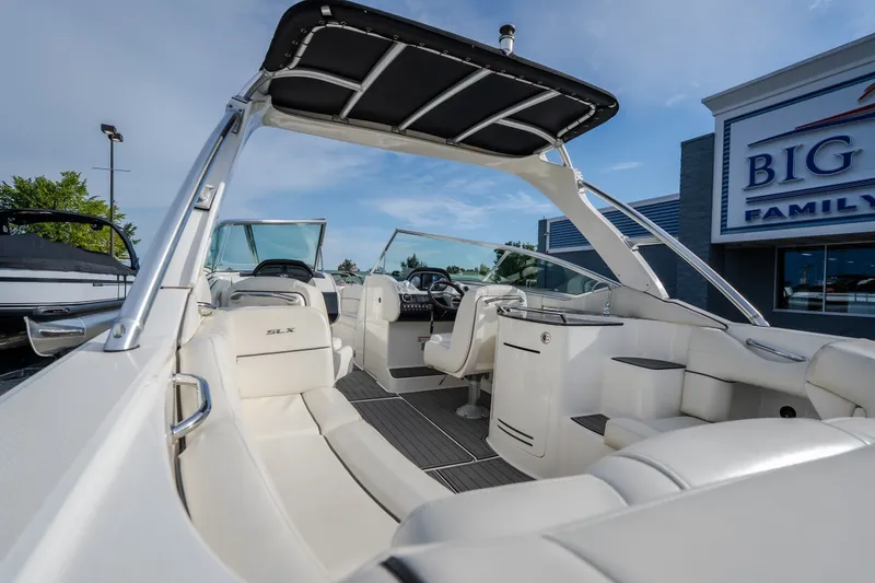 Slide: The Image of 2006 Sea Ray 270 SLX boat interior with white seating and sleek design. - 15