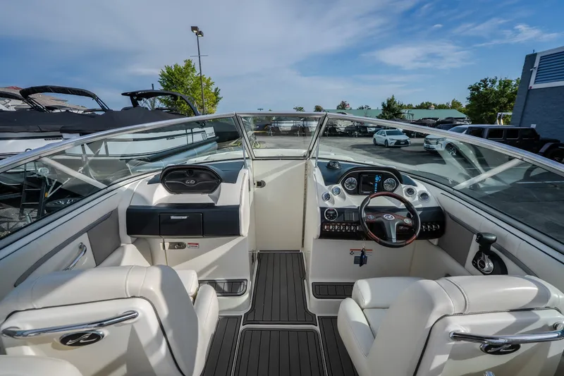Slide: The Image of 2006 Sea Ray 270 SLX boat interior with steering wheel and seating. - 26